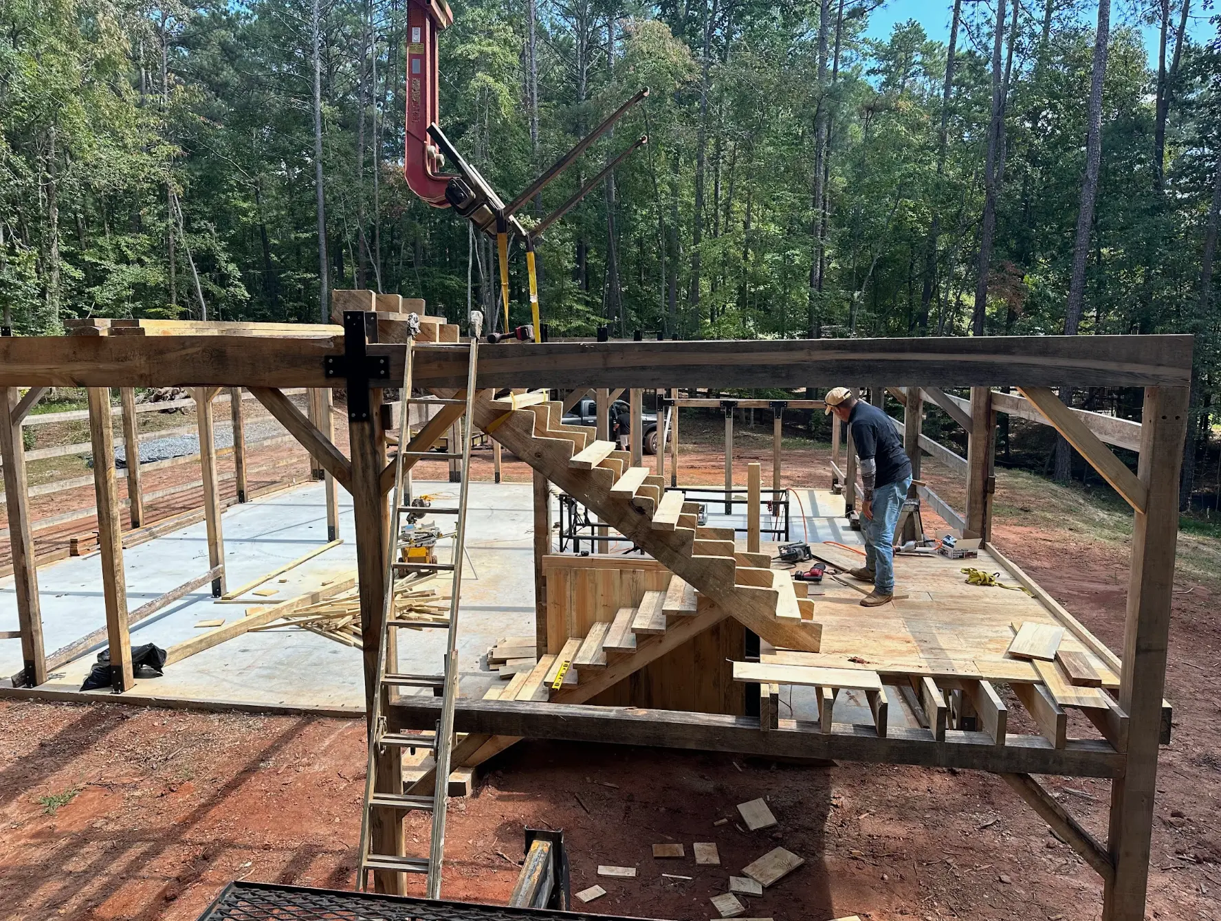 Timber frame stair construction in progress on a barn build