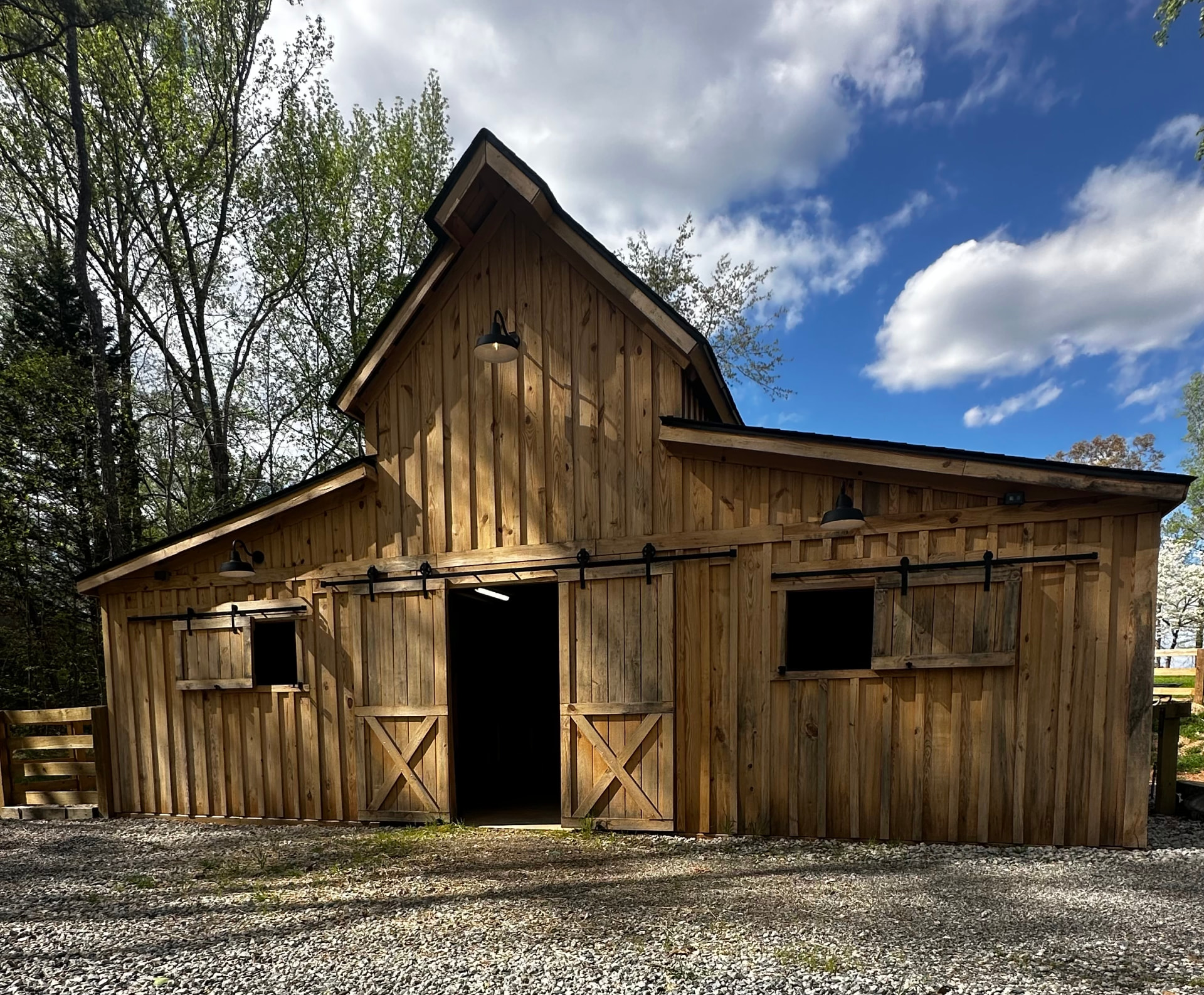 Board and batten barn with sliding barn doors on a sunny day